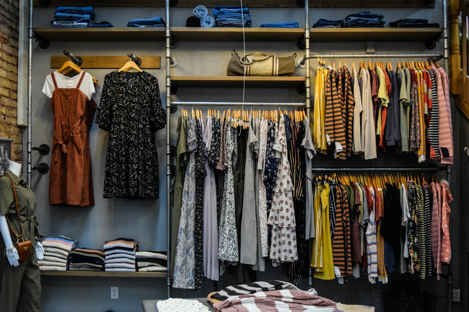 A rack of neutral-toned clothing in a boutique